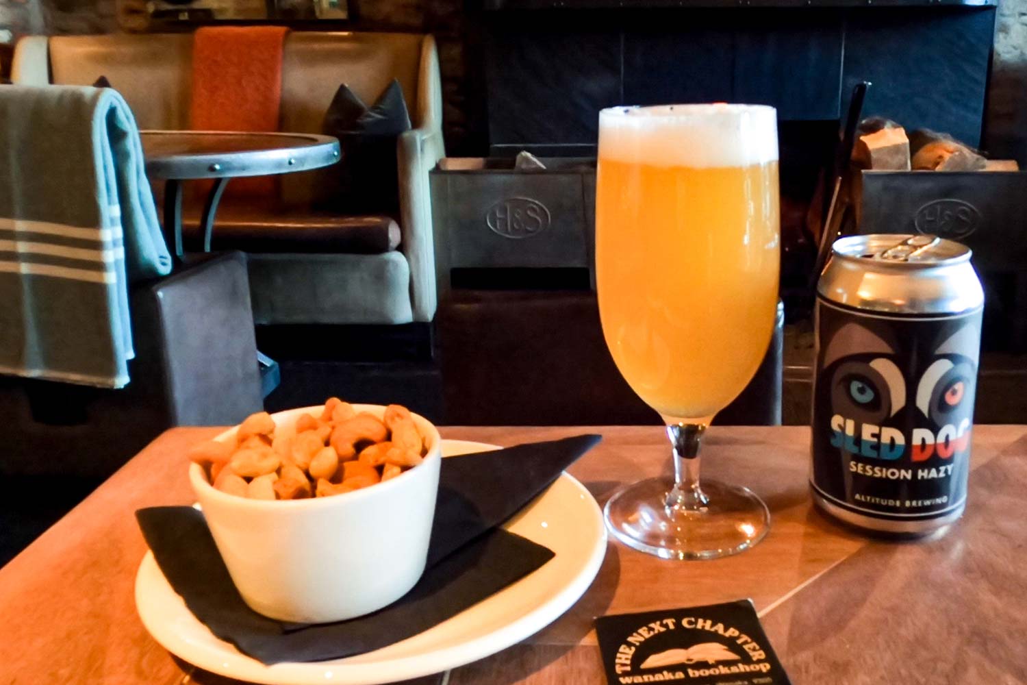 A glass of craft beer and a slightly salted bowl of roasted cashew nuts